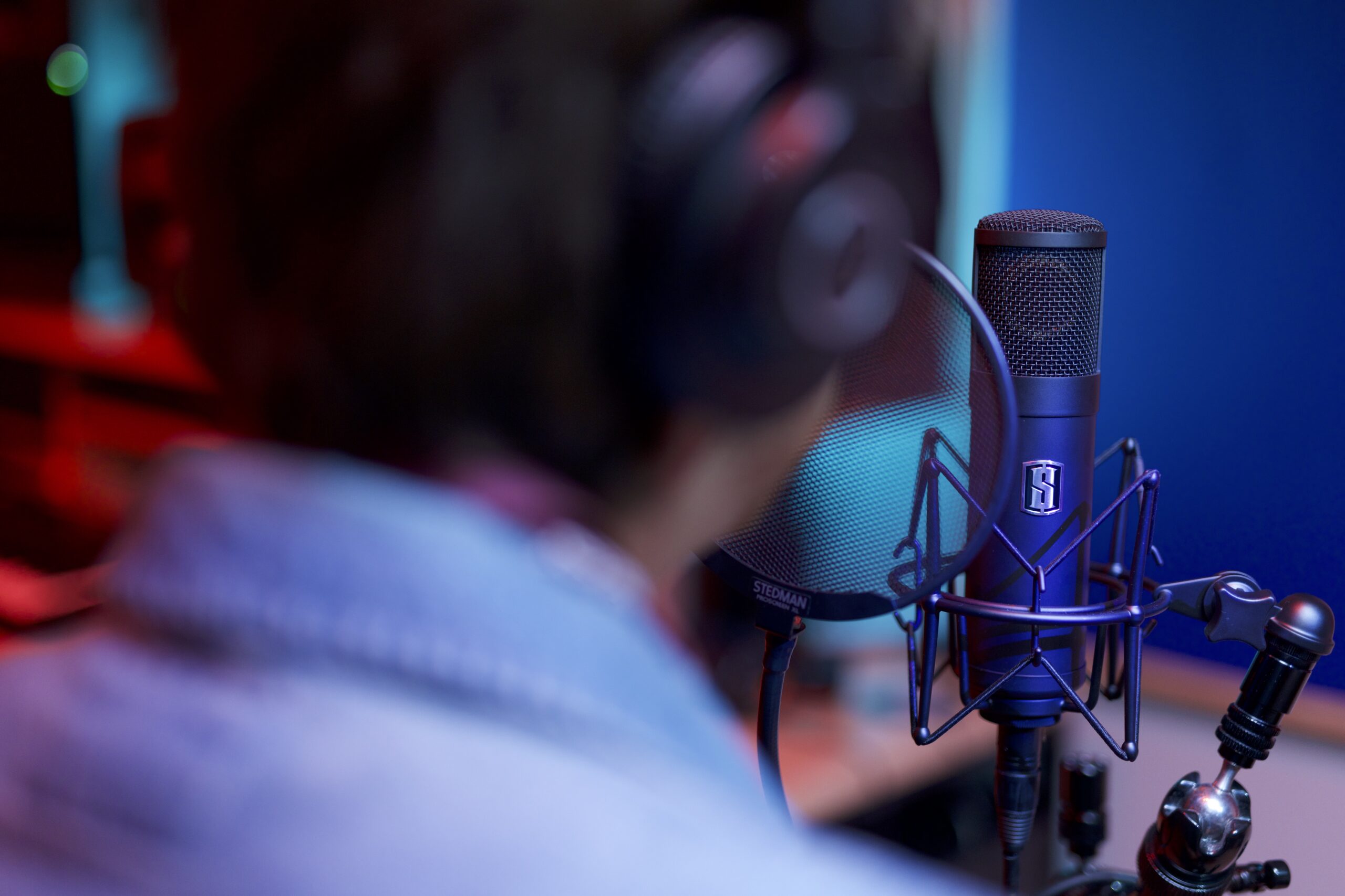 A musician recording with the Slate Digital ML-1 modeling microphone.